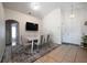 Bright dining area featuring a sleek table set, modern lighting, and stylish decor at 443 S Observatory Dr, Orlando, FL 32835