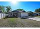 Inviting single-story home with an attached two-car garage and manicured front lawn at 443 S Observatory Dr, Orlando, FL 32835