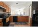 A well-equipped kitchen featuring wood cabinets and appliances at 443 S Observatory Dr, Orlando, FL 32835