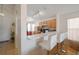 Kitchen featuring breakfast bar with white stools and view of appliances at 443 S Observatory Dr, Orlando, FL 32835
