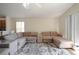 Spacious living room featuring a plush sectional sofa and stylish patterned rug at 443 S Observatory Dr, Orlando, FL 32835
