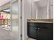 Convenient bathroom with modern fixtures and a door leading to the pool area, great for rinsing off after a swim at 4722 Terrasonesta Dr, Davenport, FL 33837
