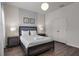 Well-lit bedroom with a comfortable bed, elegant decor, and ample closet space at 4722 Terrasonesta Dr, Davenport, FL 33837