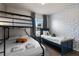 This bedroom features a bunk bed, twin bed, and cartoon themed decorations at 4722 Terrasonesta Dr, Davenport, FL 33837