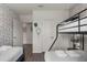 A bedroom featuring a bunk bed, twin bed, and closet space at 4722 Terrasonesta Dr, Davenport, FL 33837