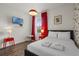 Well-lit bedroom with a bright window, TV, and decorative accents at 4722 Terrasonesta Dr, Davenport, FL 33837