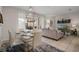 Open dining area featuring a glass table, seating for six, and seamless access to the living room at 4722 Terrasonesta Dr, Davenport, FL 33837