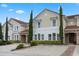 Charming townhome boasts a well-maintained facade, red-tiled roof, and meticulous landscaping at 4722 Terrasonesta Dr, Davenport, FL 33837