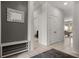 Hallway features neutral paint, tiled floors, and easy access to different areas of the home at 4722 Terrasonesta Dr, Davenport, FL 33837