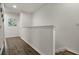 Upstairs hallway featuring wood-look flooring and light walls at 4722 Terrasonesta Dr, Davenport, FL 33837