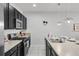 Stylish kitchen features stainless steel appliances, gas cooktop, and elegant pendant lighting at 4722 Terrasonesta Dr, Davenport, FL 33837