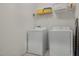 Neat laundry room featuring a washer, dryer, and storage space at 4722 Terrasonesta Dr, Davenport, FL 33837