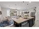 The open-concept layout connects the kitchen, dining area, and living room, creating a seamless flow at 4722 Terrasonesta Dr, Davenport, FL 33837