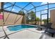 The screened-in patio features a private pool with lounge chairs at 4722 Terrasonesta Dr, Davenport, FL 33837