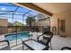 Screened-in patio features a private pool, barbecue grill, and dining area at 4722 Terrasonesta Dr, Davenport, FL 33837