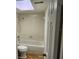 Bathroom with a shower-tub combo, wood look floors, and a toilet at 500 Newell Hill Rd # 109A, Leesburg, FL 34748