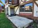 Exterior of home with a front porch, brick accents, and lawn at 500 Newell Hill Rd # 109A, Leesburg, FL 34748
