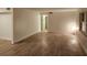 Spacious living room featuring modern laminate flooring and ample natural light at 500 Newell Hill Rd # 109A, Leesburg, FL 34748