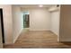 Bright living room featuring modern laminate flooring and open layout at 500 Newell Hill Rd # 109A, Leesburg, FL 34748