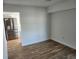 Bright, open-concept living space featuring laminate flooring and stainless steel kitchen appliances at 500 Newell Hill Rd # 109A, Leesburg, FL 34748