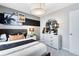Trendy bedroom with a plush bed, unique art, and plenty of space for comfort at 5044 Starling Bird Ln, St Cloud, FL 34771