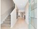Bright foyer with stairs, tiled floor, and open view to the living area offering a welcoming entrance at 5044 Starling Bird Ln, St Cloud, FL 34771