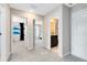 Bright hallway showcasing the bedrooms and bathroom with neutral walls and carpet at 5044 Starling Bird Ln, St Cloud, FL 34771
