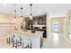 Kitchen with stainless steel appliances, modern lighting, a breakfast bar with seating at 5044 Starling Bird Ln, St Cloud, FL 34771