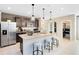 Modern kitchen with a breakfast bar, stainless steel appliances, and walk-in pantry at 5044 Starling Bird Ln, St Cloud, FL 34771