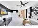 Upstairs living room featuring a white sofa, a modern ceiling fan and television with views of the beach at 5044 Starling Bird Ln, St Cloud, FL 34771