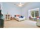 Serene bedroom with a window seat, white furniture, and ample natural light at 5100 Cranes Point Ct, Orlando, FL 32839
