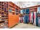 Walk-in closet with custom shelving, drawers, and hanging racks at 5100 Cranes Point Ct, Orlando, FL 32839