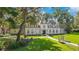 Stunning exterior elevation showcasing manicured landscaping and a custom walkway to the front door at 5100 Cranes Point Ct, Orlando, FL 32839