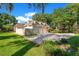 Home exterior showcasing an attached three-car garage and expansive driveway at 5100 Cranes Point Ct, Orlando, FL 32839