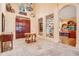 Elegant foyer featuring a stunning entrance door, tile floors, and decorative wrought iron grates at 5100 Cranes Point Ct, Orlando, FL 32839