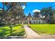 Stately home with manicured front lawn, walkway and gated entry at 5100 Cranes Point Ct, Orlando, FL 32839