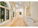 Charming hallway with elegant archways, floral accents, and custom cabinetry at 5100 Cranes Point Ct, Orlando, FL 32839