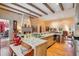 Gourmet kitchen features granite countertops, stainless appliances, and custom beams at 5100 Cranes Point Ct, Orlando, FL 32839