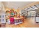Open-concept space with fireplace, exposed beams, hardwood floors, and decorative furnishings at 5100 Cranes Point Ct, Orlando, FL 32839