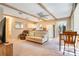 Inviting living area showcasing wood beams, open layout, and neutral color palette at 5100 Cranes Point Ct, Orlando, FL 32839