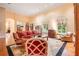 Spacious living room featuring large windows, hardwood floors, and elegant furnishings at 5100 Cranes Point Ct, Orlando, FL 32839