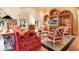 Inviting living room with hardwood floors, custom built-ins, and a cozy fireplace at 5100 Cranes Point Ct, Orlando, FL 32839