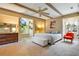 Bright and airy main bedroom with wood beams, ample natural light, and neutral decor at 5100 Cranes Point Ct, Orlando, FL 32839