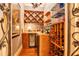 Charming wine cellar complete with custom racks, a small refrigerator, and ample storage at 5100 Cranes Point Ct, Orlando, FL 32839