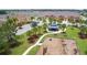 Aerial view of a community park with a playground, picnic pavilion and walking paths at 5123 Crown Haven Dr, Kissimmee, FL 34746