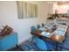 Dining room with modern furniture, table setting, and an eye-catching art piece at 5123 Crown Haven Dr, Kissimmee, FL 34746