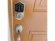 Contemporary front door with a digital lock for added security at 5123 Crown Haven Dr, Kissimmee, FL 34746