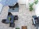 Inviting patio with a dining table, umbrella, grill, and charming decor for outdoor relaxation at 5123 Crown Haven Dr, Kissimmee, FL 34746