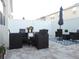 Outdoor patio with a table, comfortable seating, umbrella, and stylish rug perfect for entertaining at 5123 Crown Haven Dr, Kissimmee, FL 34746