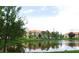 Scenic view of homes across the community pond at 5123 Crown Haven Dr, Kissimmee, FL 34746